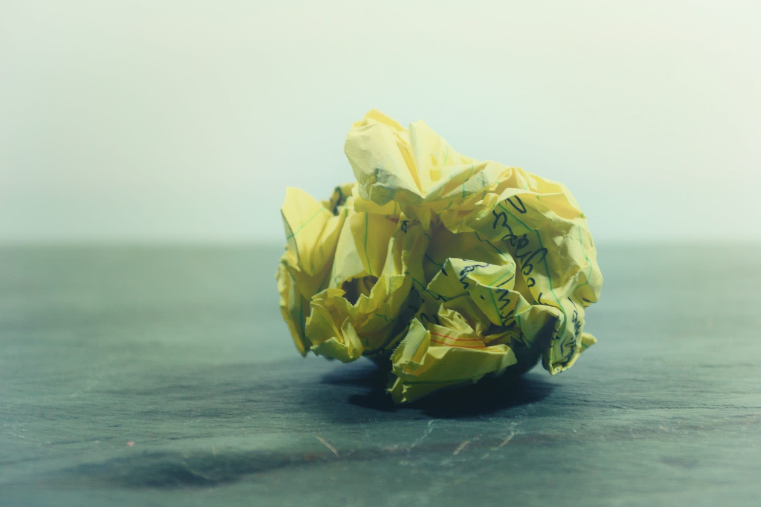 A piece of scrunched up yellow paper