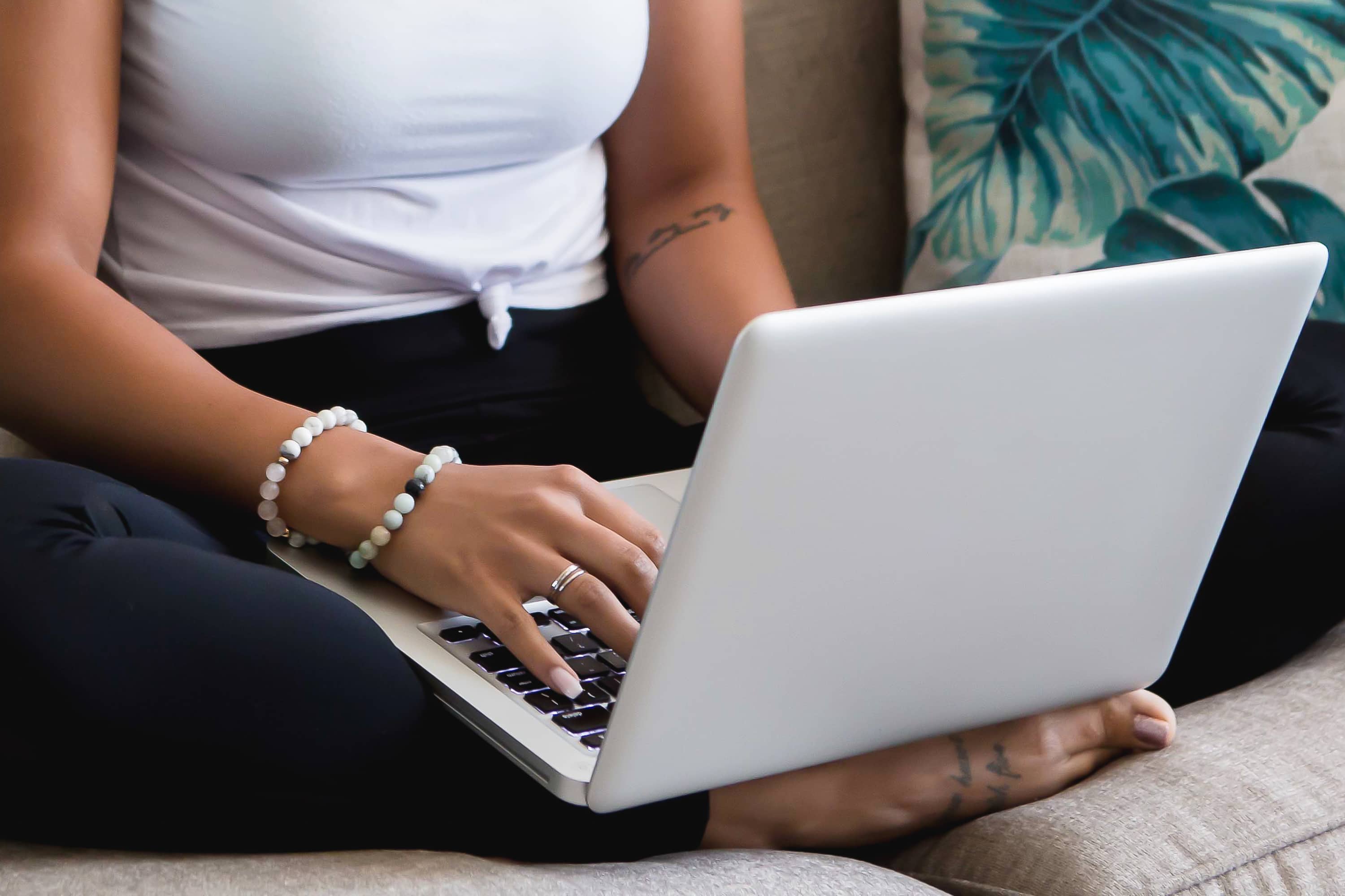 Woman typing on a laptop