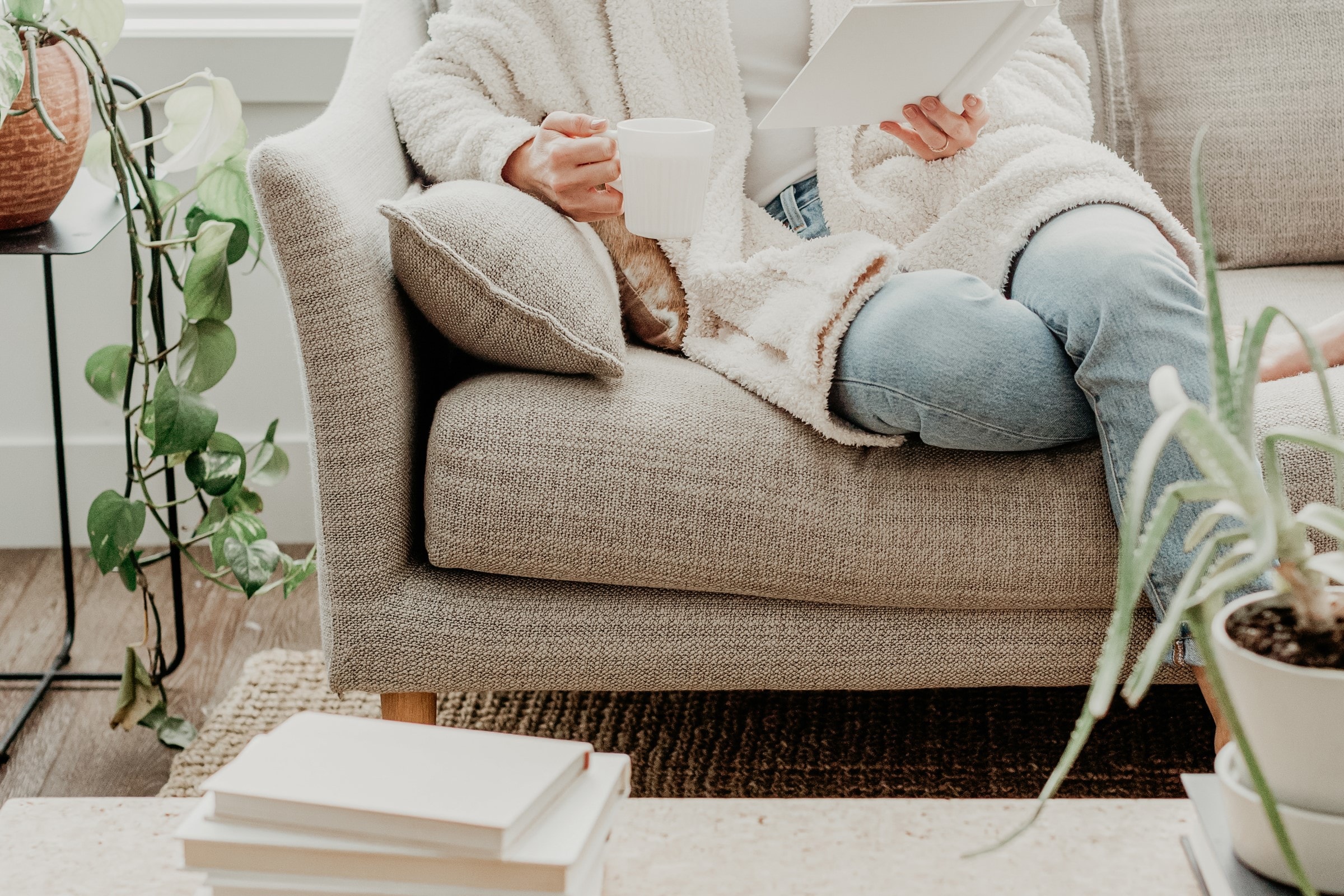 Woman sitting on a sofa reading