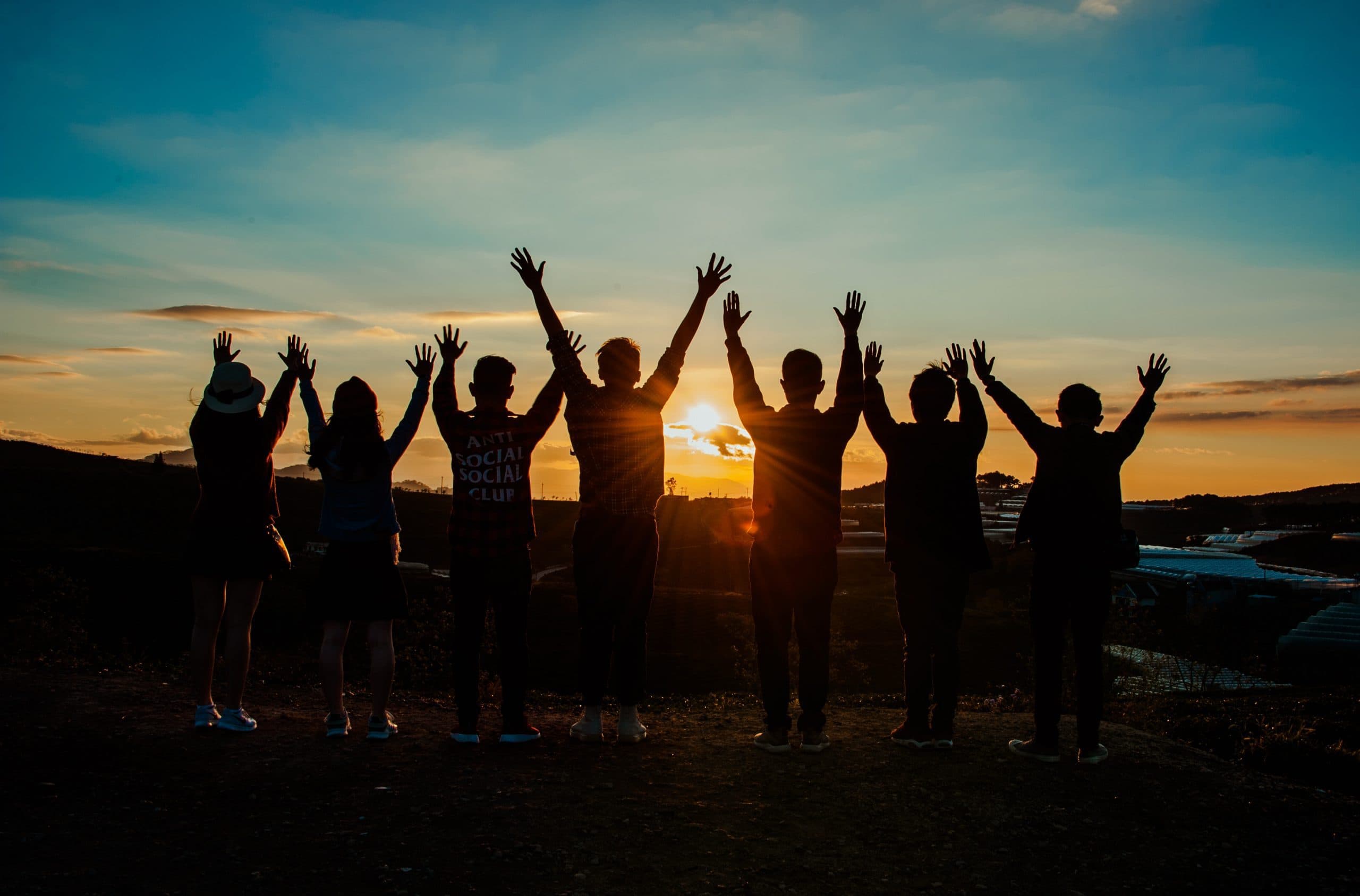 Silhouette of bloggers celebrating together